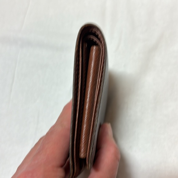 Louis Vuitton Monogrammed bi-fold wallet - Picture 10 of 13